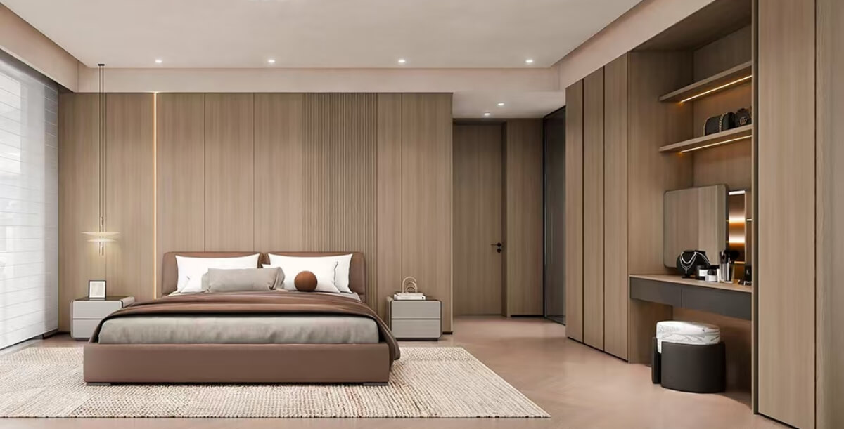 Minimalist master bedroom featuring floor-to-ceiling fitted wardrobes, a built-in makeup vanity desk with a circular backlit mirror, and decorative fluted wall paneling.